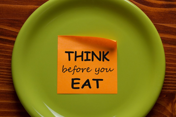 Think Before You Eat written on sticky note on the green plate