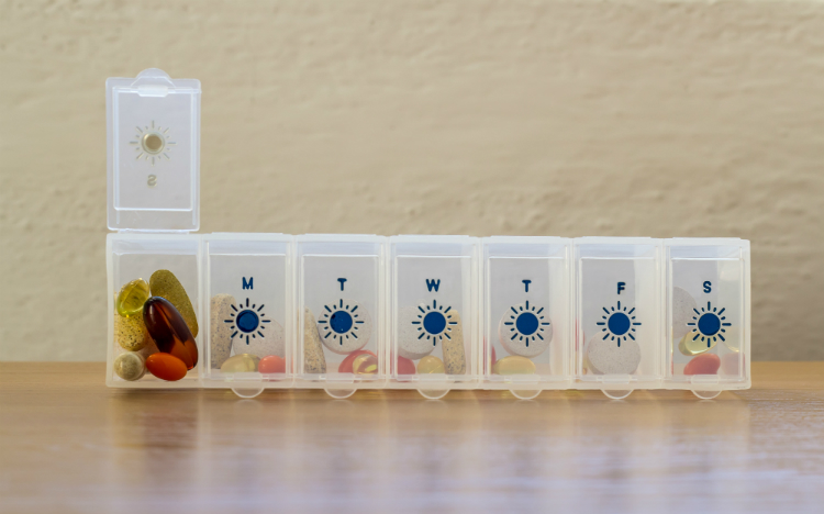 Vitamins and supplements in a daily organizer